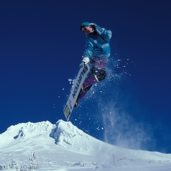 Man snowboarding during daytime