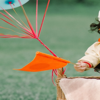 Photo of Baby Standing Near Wicker Basket
