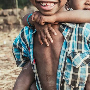 Boy Carrying a Child