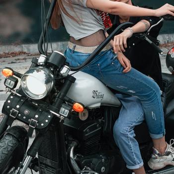 A Young Couple Posing Together on a Motorcycle