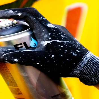 A Person with Black Gloves Holding a Spray Paint