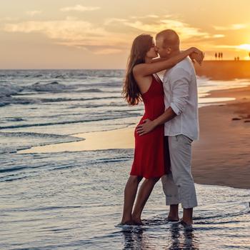 Beach couple kiss romantic love