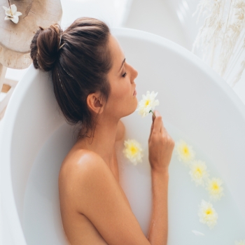 The beautiful woman sleeping in the bath tub