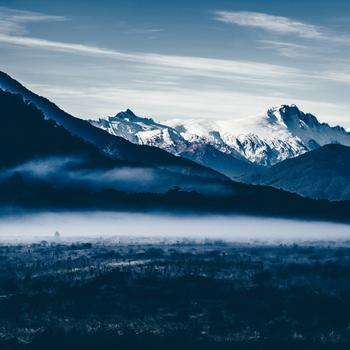 Snow Covered Mountains Under Cloudy Sky During Daytime Full
